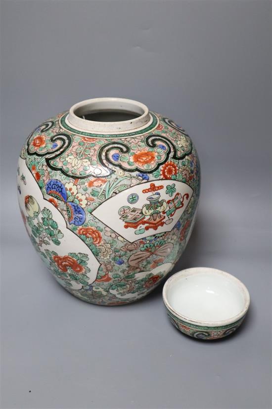 A Chinese famille verte jar and cover, Kangxi mark, 19th century, height 29cm